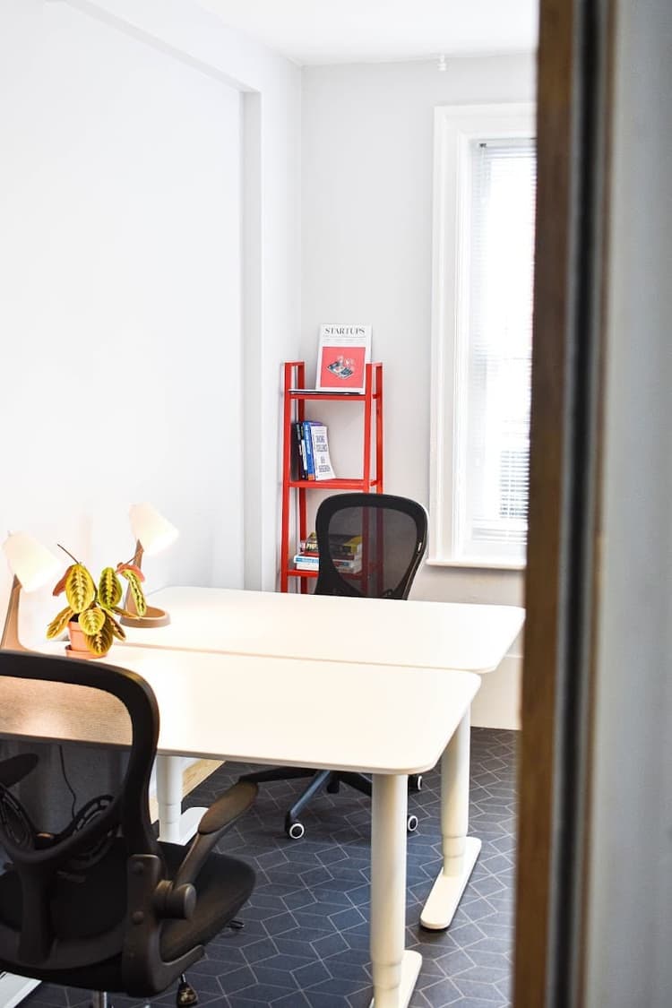 Two desks in a bright office located in Propeller Exmouth